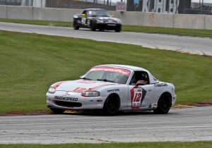 Running Spec Miata at Road America in Elkhart Lake, Wisconsin.  Photo by Mike Clemens